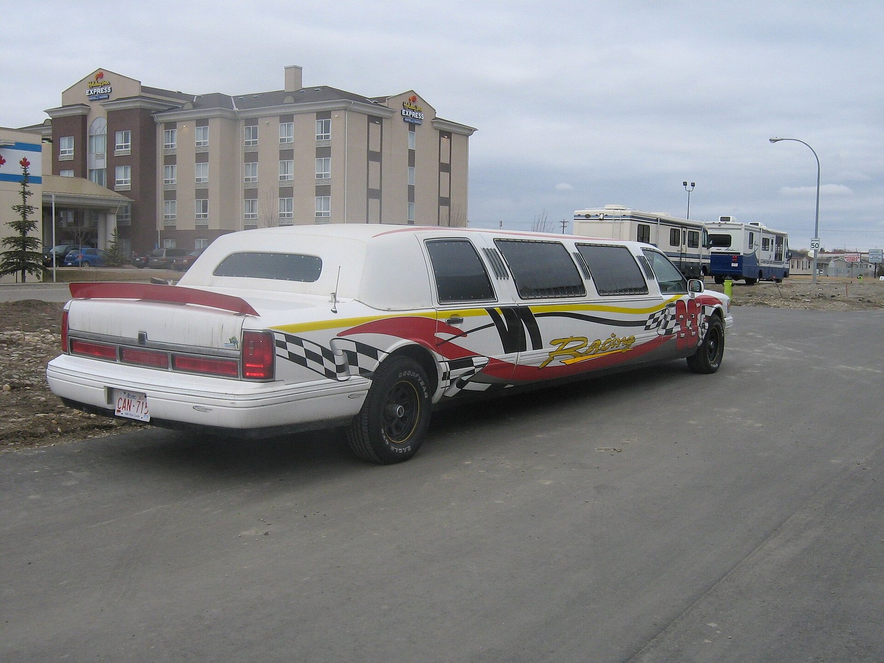 White stretch limousine in profile